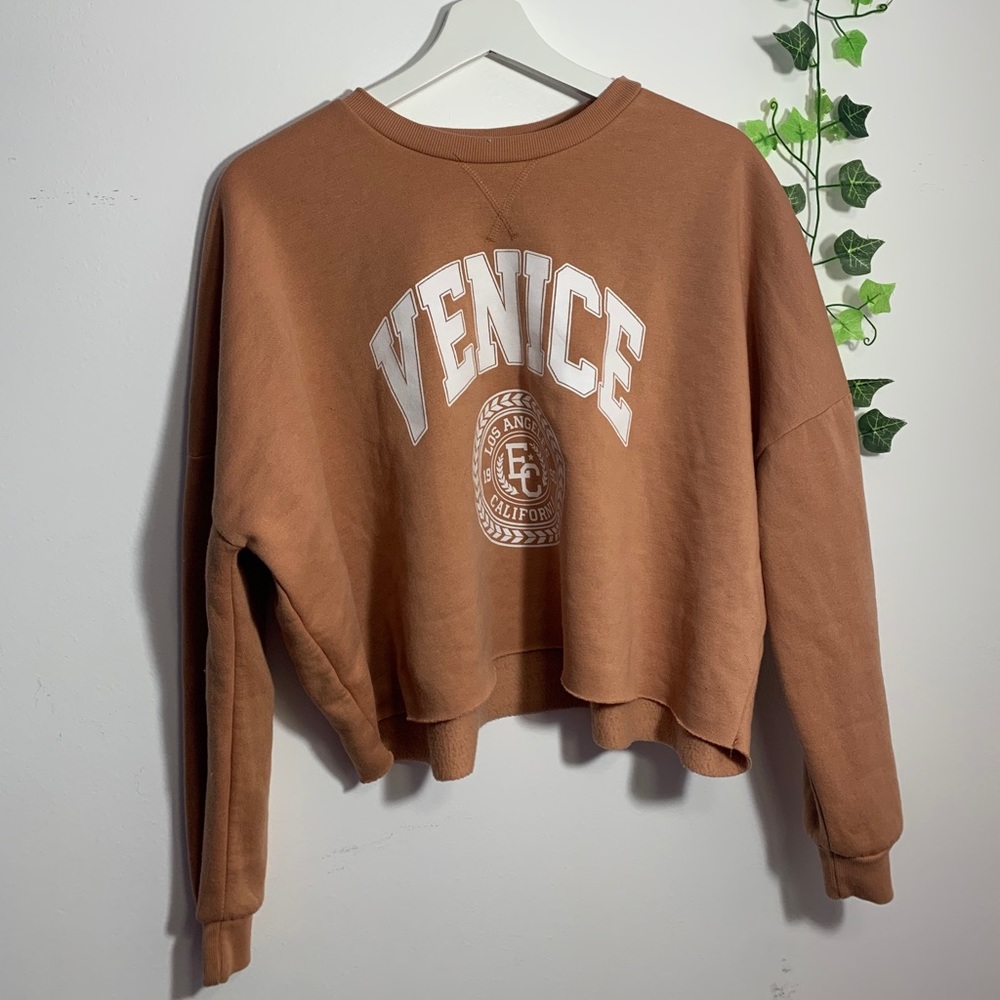 (never worn)beige(orange cream) colored sweatshirt